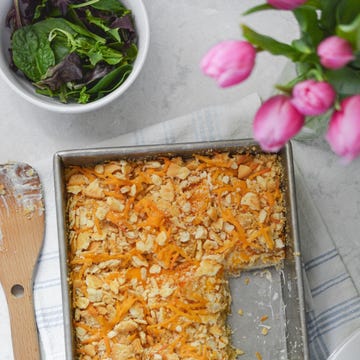 Baking dish with a casserole and a side of salad.